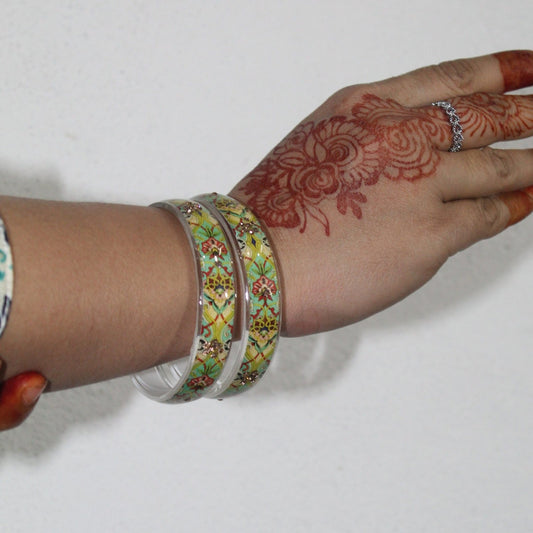 A model showing Handcrafted Floral Resin Bangles wearing in his hands