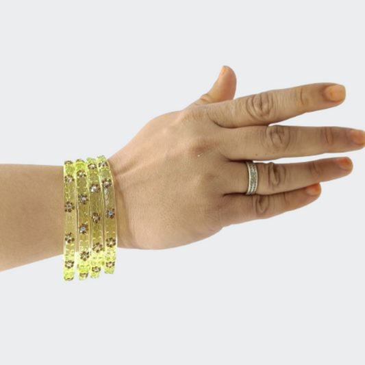 Lime Green & Gold-Tone Embossed Floral Bangle in Hand