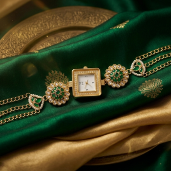 Gold green Kashmiri bracelet watch with pearl chains on decorative background, bridal watch for women
