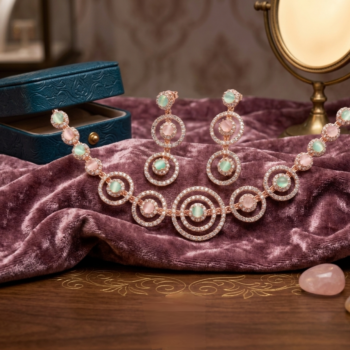 Rose gold necklace set with circular crystal design and pastel stones isolated on white background with earrings